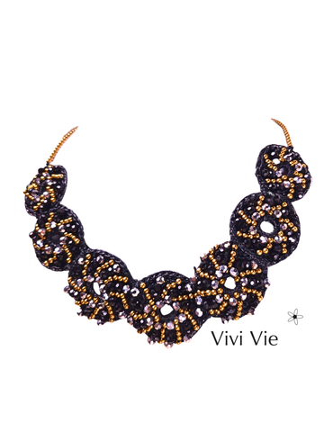 A statment necklace with lusturious circular  elegance .