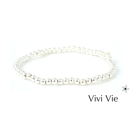 Sleek silver spher bracelet a classic.