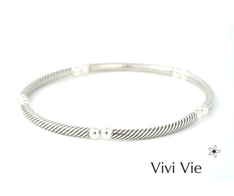 Siver elegance with a urban vibe so versitile create your style  with Vivi vie  tube and ball bracelets. .
