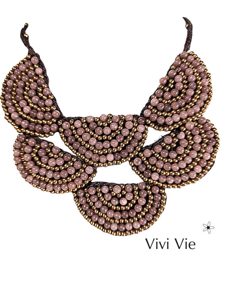 A statment fan necklace to adorn.