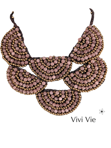 A statment fan necklace to adorn.