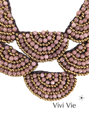 A statment fan necklace to adorn.