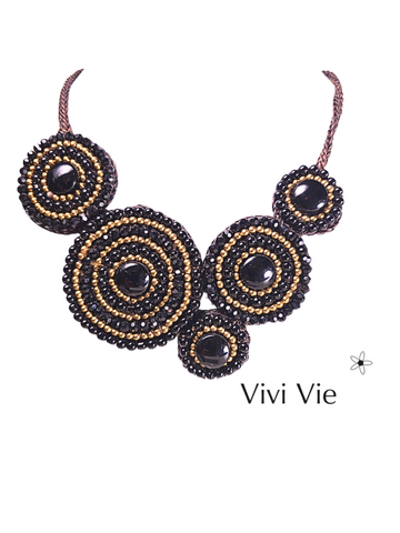 Solaris   circles midnight's  gold statment necklace