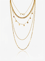 Gold disk necklace.