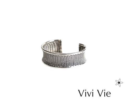 Silver concave weave cuff design tribal  inspired.