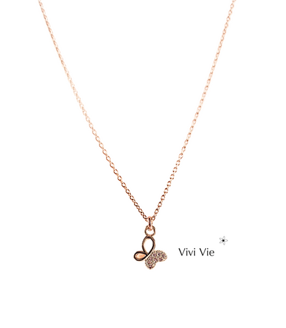 Gold butterfly pendant with wings that sparkle with cubic zarconia