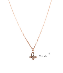 Gold butterfly pendant with wings that sparkle with cubic zarconia