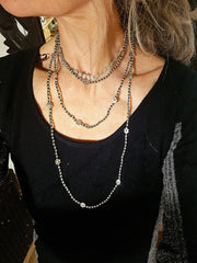 The infifiate flower strand Layering with silver beads and flowers.