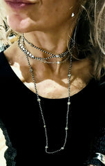 The infifiate flower strand Layering with silver beads and flowers.