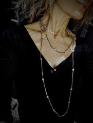 The infifiate flower strand Layering with silver beads and flowers.