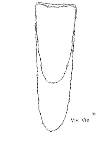 The infifiate flower strand Layering with silver beads and flowers.