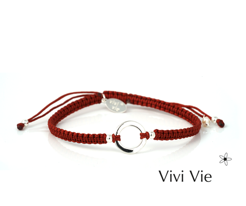 Karma circle braclet on wine colour cord, circles are often used to bring positivity.