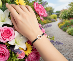 Sterling silver circle frienship braclets with a black adjustable extender cord.