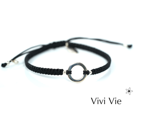 Sterling silver circle frienship braclets with a black adjustable extender cord.