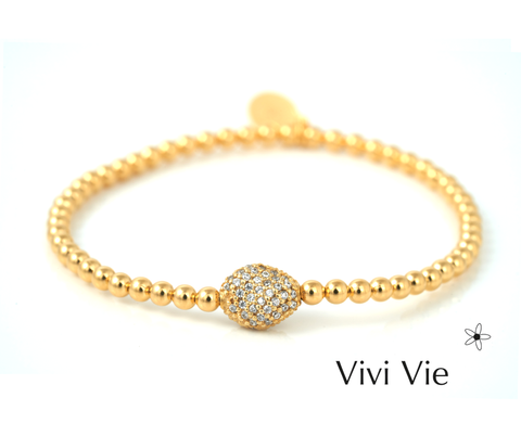 Gold sphere  braclet with cubuc zarconia.