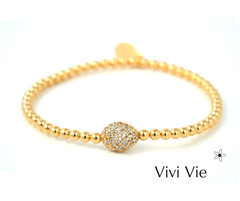 Gold sphere  braclet with cubuc zarconia.