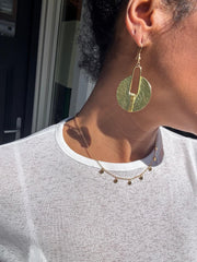 Aura gold drop hammered  finish earrings.
