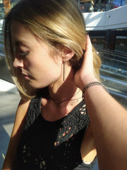 Black onyx faceted stone on  on a fine silver chain.
