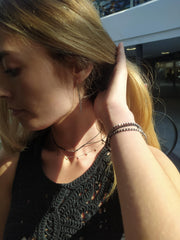 Black onyx faceted stone on  on a fine silver chain.