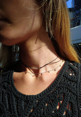 Black onyx faceted stone on  on a fine silver chain.
