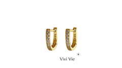 Gold earings with cubic zirconia.