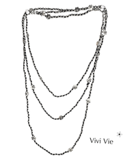 The infifiate flower strand Layering with silver beads and flowers.