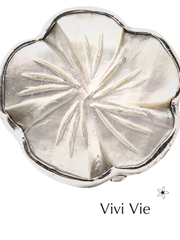 Seashell with flower ring.