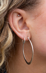 THE SILVER LUMINA OVAL-V HOOP EARRINGS.
