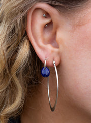 THE SILVER LUMINA OVAL-V HOOP EARRINGS.