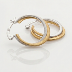 Sleak Dual-Tone Hoop Earring Elgance.